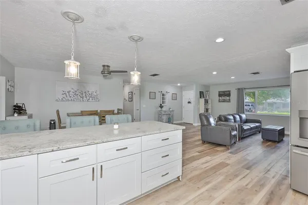 a spacious bathroom with double vanity and a sink