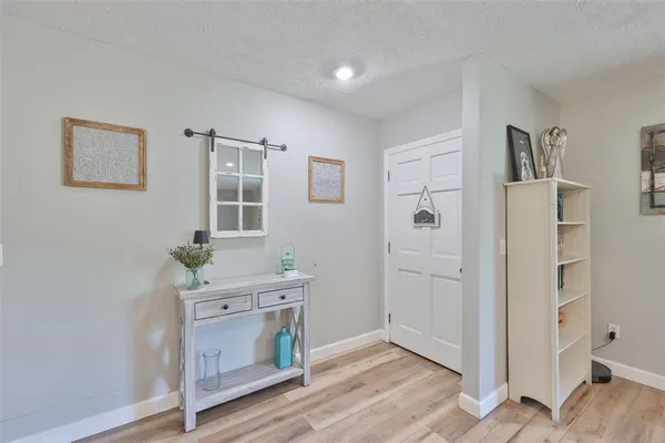 a room with a door and wooden floor