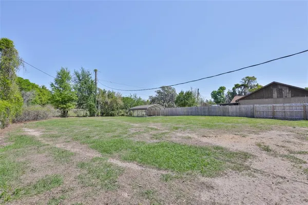 a view of outdoor space with deck and yard