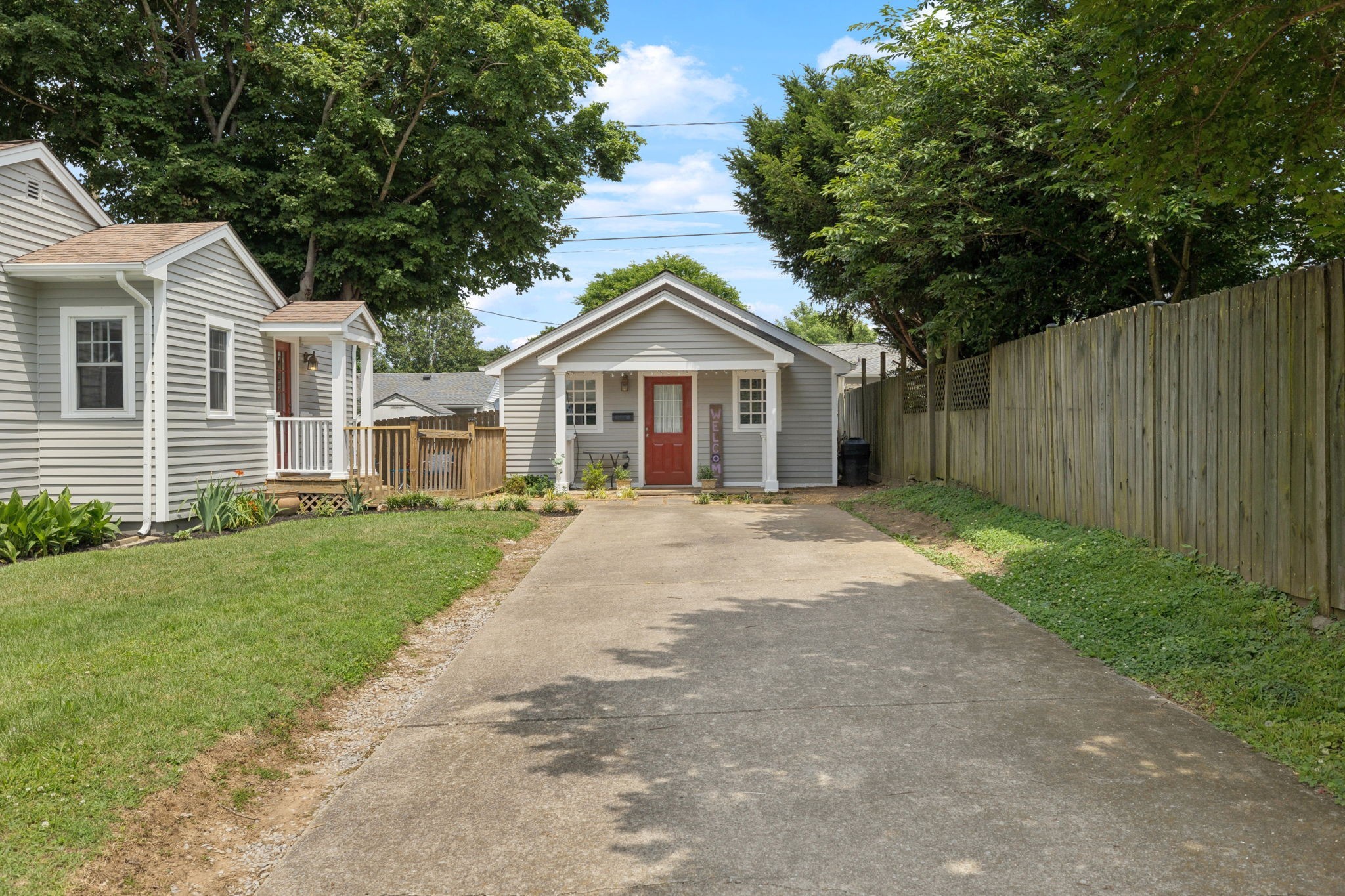 405 Lawrence Street Old Hickory, TN 37138 - Photo 11 of 52 a front view of a house with a garden and trees