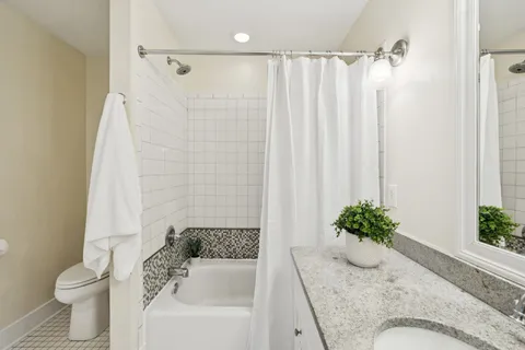 a bathroom with a sink a mirror and a shower