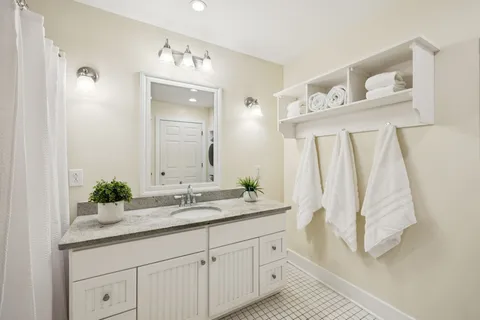 a utility room with sink dryer and washer