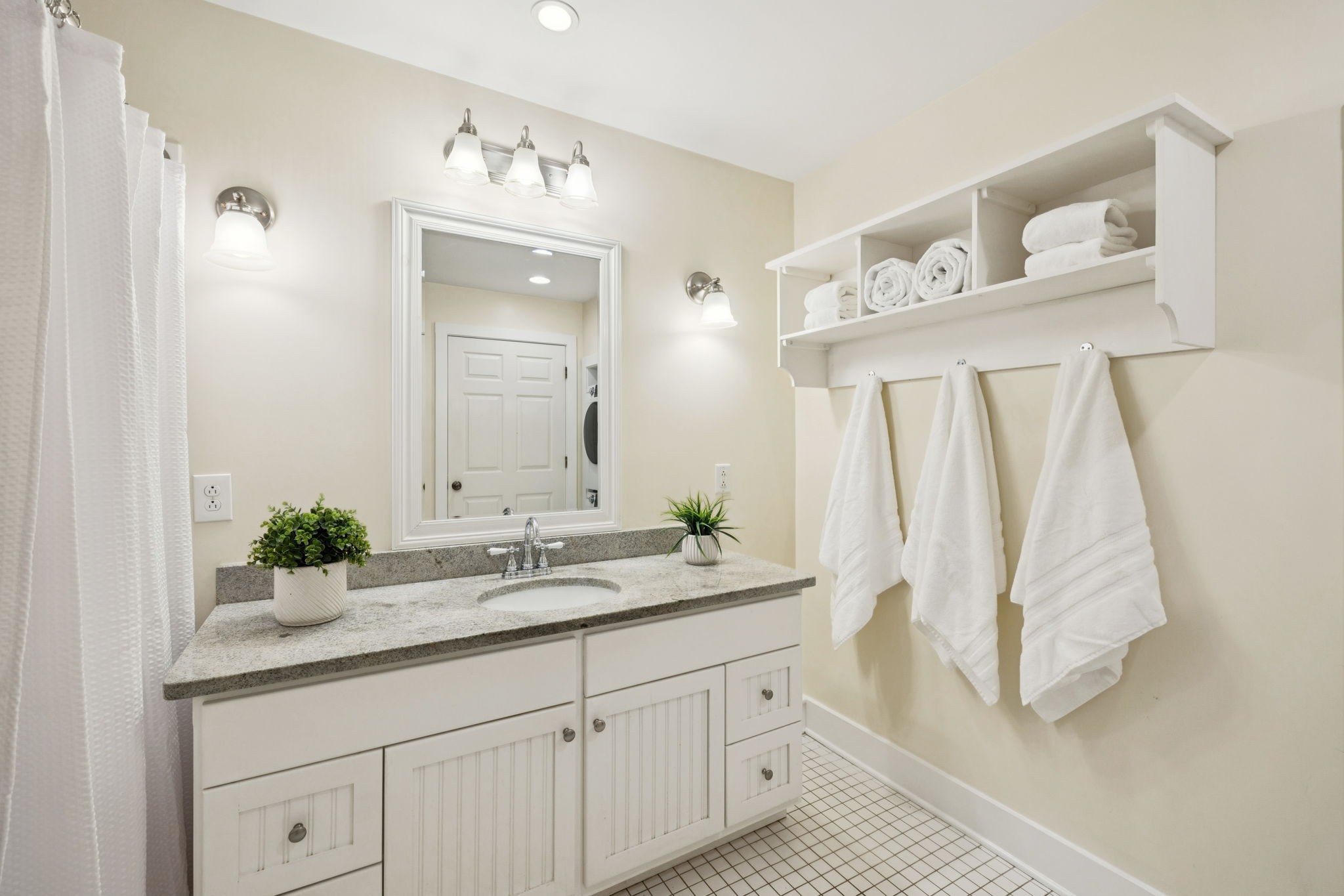 405 Lawrence Street Old Hickory, TN 37138 - Photo 31 of 52 a bathroom with a sink a mirror and a shower