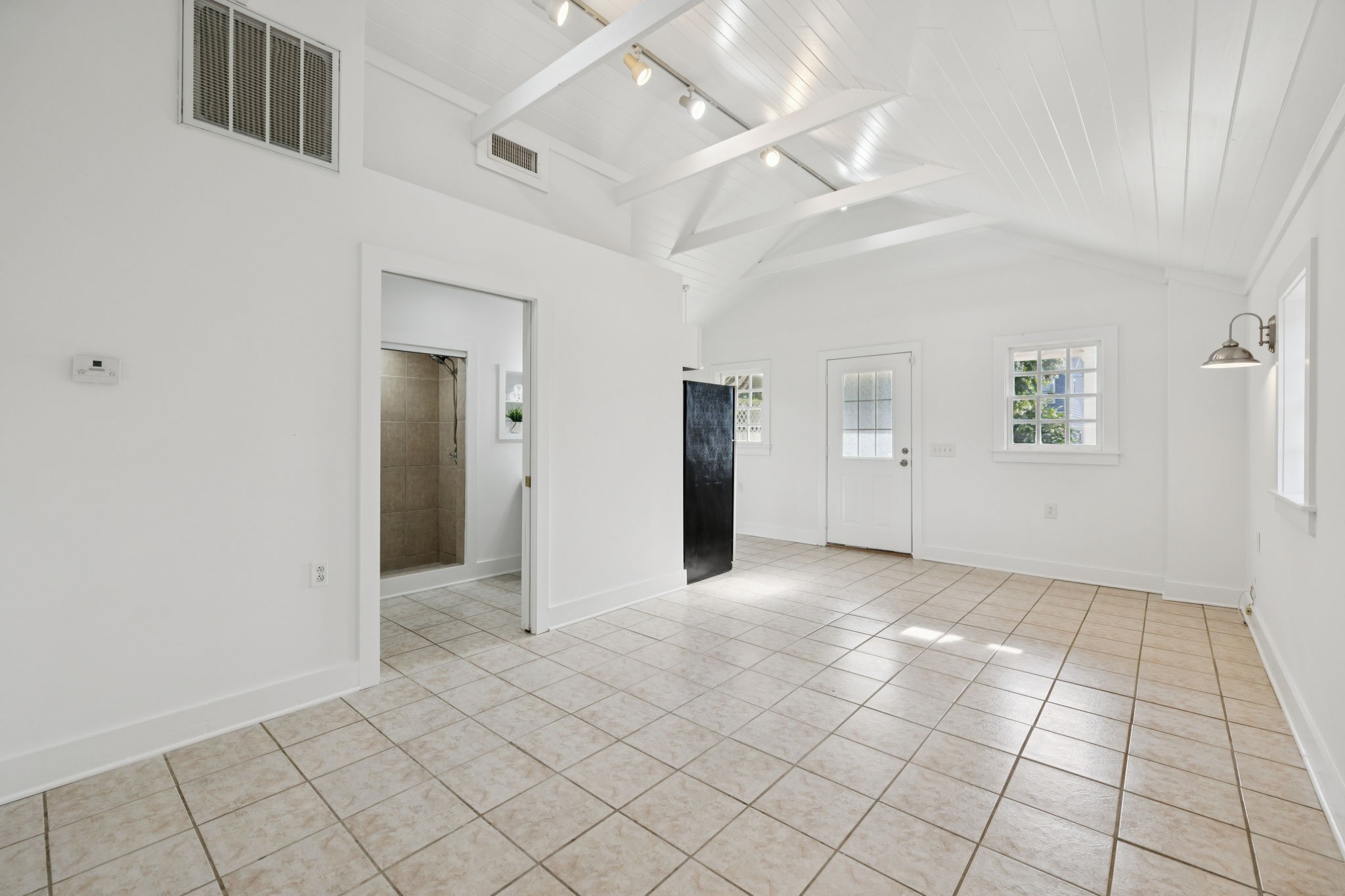 405 Lawrence Street Old Hickory, TN 37138 - Photo 39 of 52 a view of an empty room with window and chandelier fan