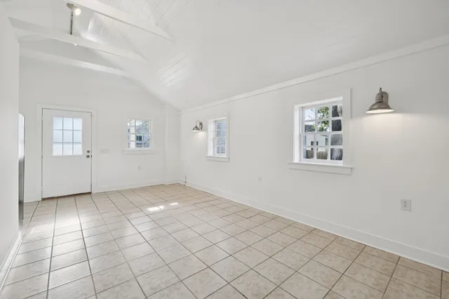 a bathroom with a toilet a sink and shower