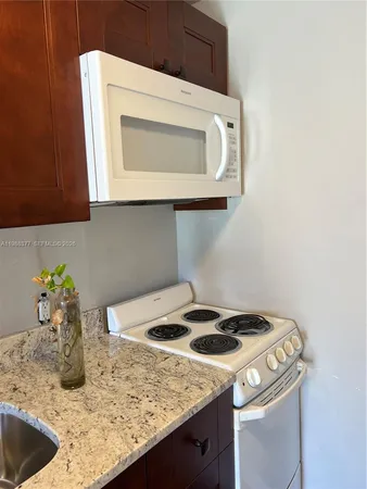 a kitchen with a stove and a sink