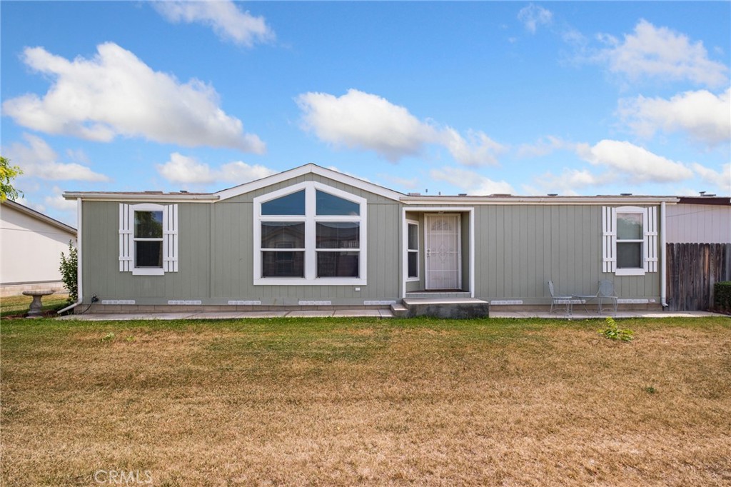 21621 Sandia Road, Unit 128 Apple Valley, CA 92308 - Photo 15 of 41 a view of a house with a yard