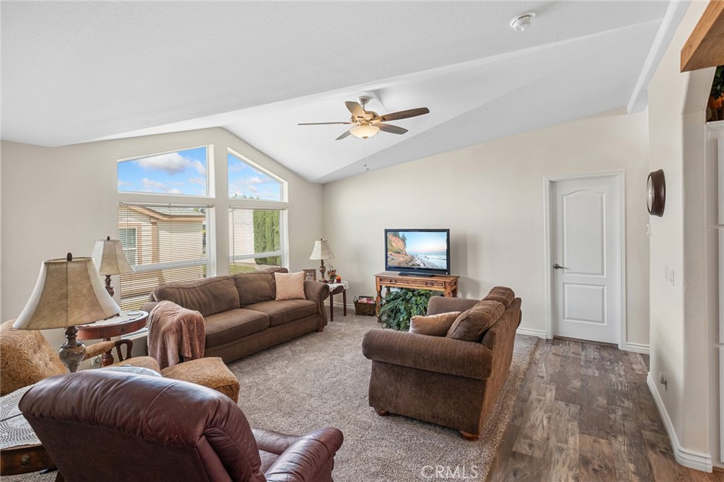 21621 Sandia Road, Unit 128 Apple Valley, CA 92308 - Photo 19 of 41 a living room with furniture a ceiling fan and a window