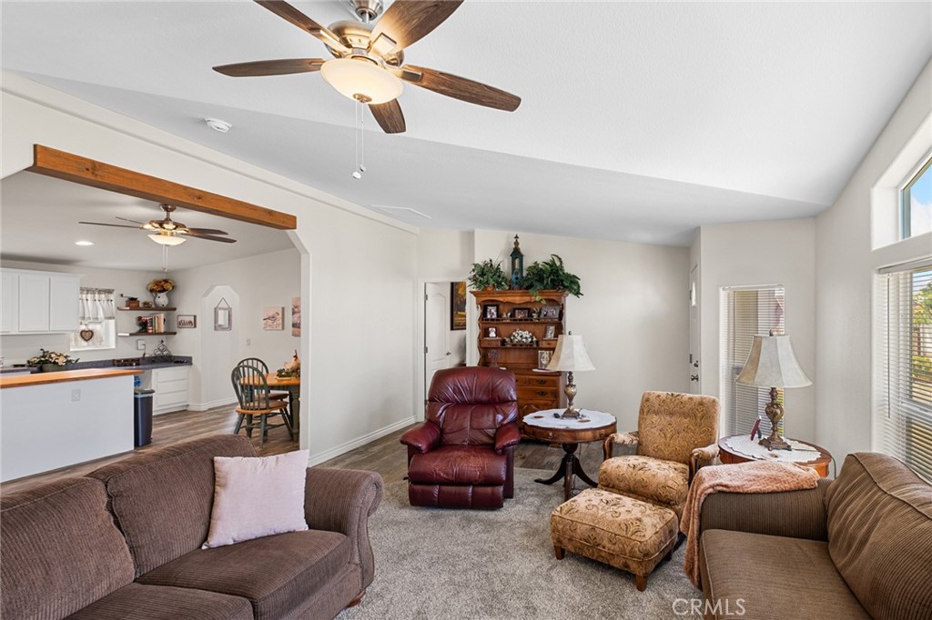 21621 Sandia Road, Unit 128 Apple Valley, CA 92308 - Photo 20 of 41 a living room with furniture and a chandelier