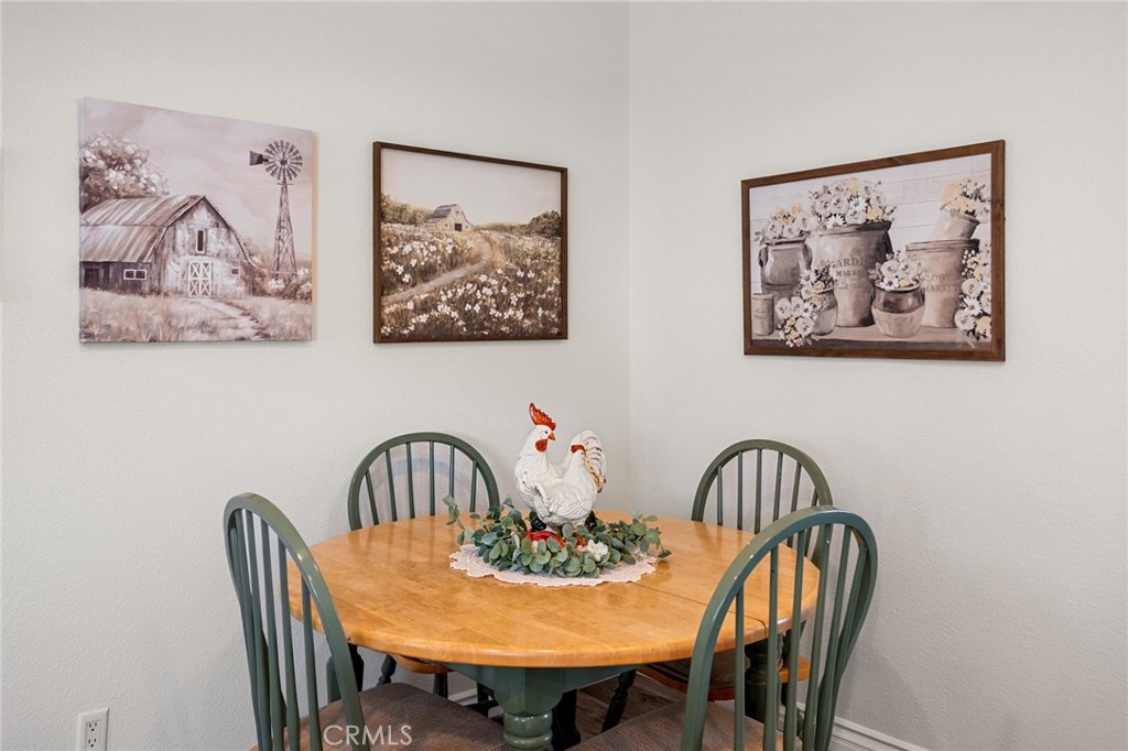 21621 Sandia Road, Unit 128 Apple Valley, CA 92308 - Photo 24 of 41 a view of a dining room with furniture and a potted plant