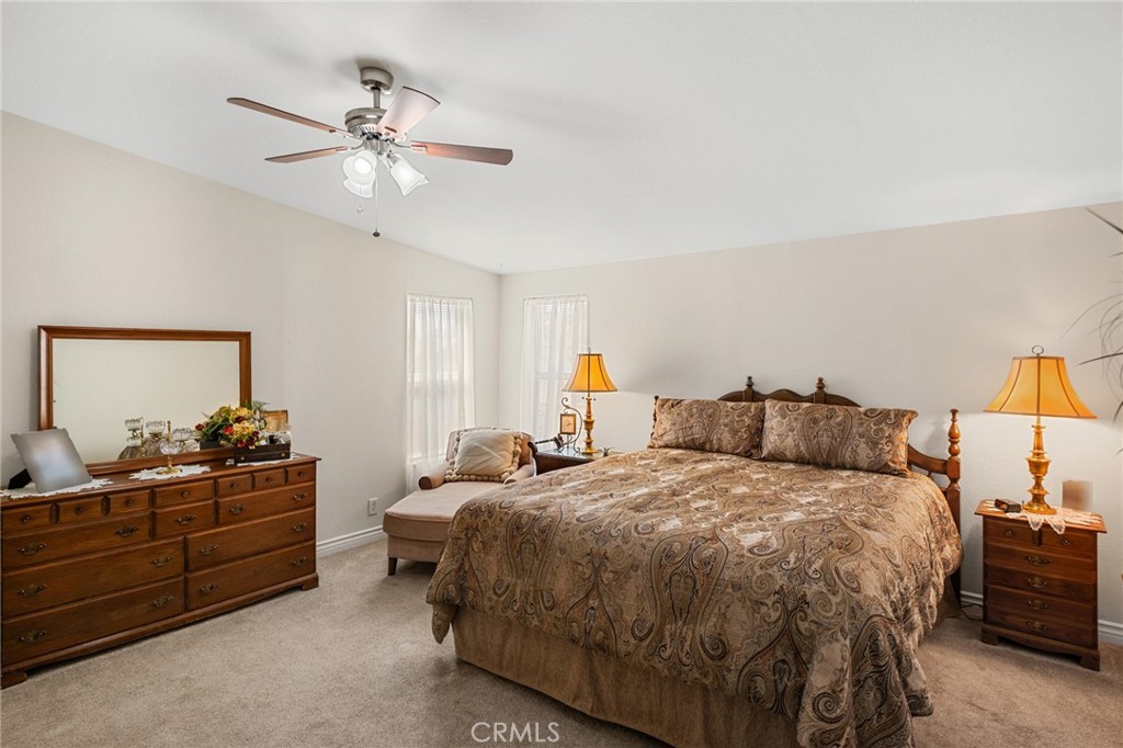 21621 Sandia Road, Unit 128 Apple Valley, CA 92308 - Photo 28 of 41 a bedroom with double bed and window