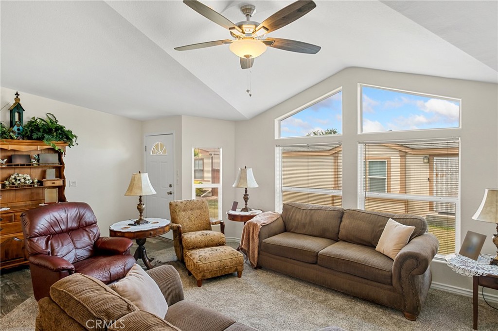 21621 Sandia Road, Unit 128 Apple Valley, CA 92308 - Photo 30 of 41 a living room with furniture and a large window