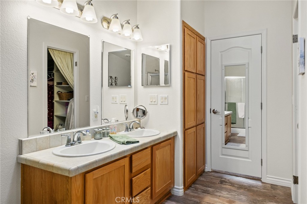 21621 Sandia Road, Unit 128 Apple Valley, CA 92308 - Photo 32 of 41 a bathroom with a sink and a mirror