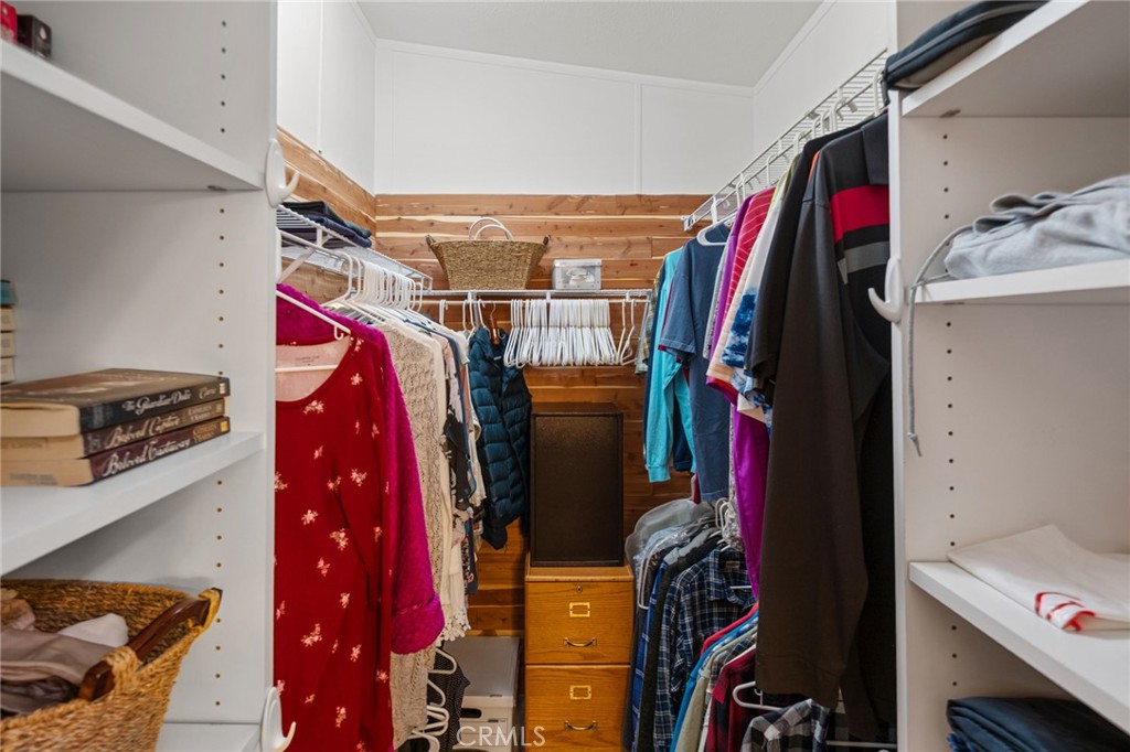 21621 Sandia Road, Unit 128 Apple Valley, CA 92308 - Photo 33 of 41 a view of walk in closet with clothes and shoes
