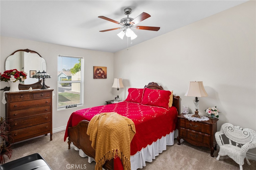 21621 Sandia Road, Unit 128 Apple Valley, CA 92308 - Photo 35 of 41 a bedroom with a bed and a dresser