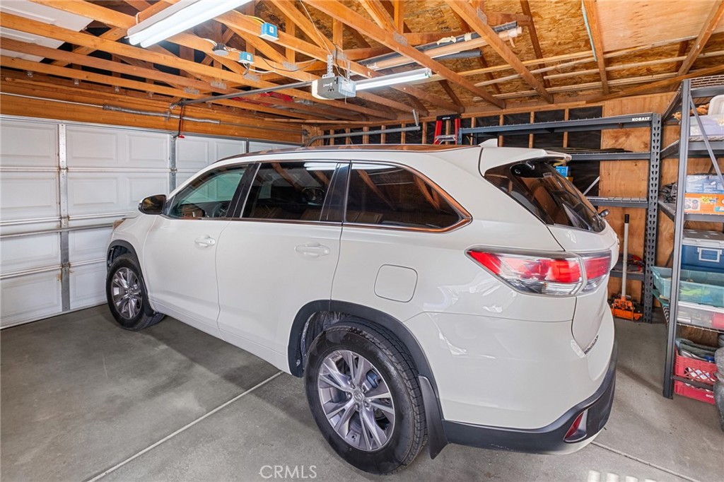 21621 Sandia Road, Unit 128 Apple Valley, CA 92308 - Photo 41 of 41 a view of a car in garage