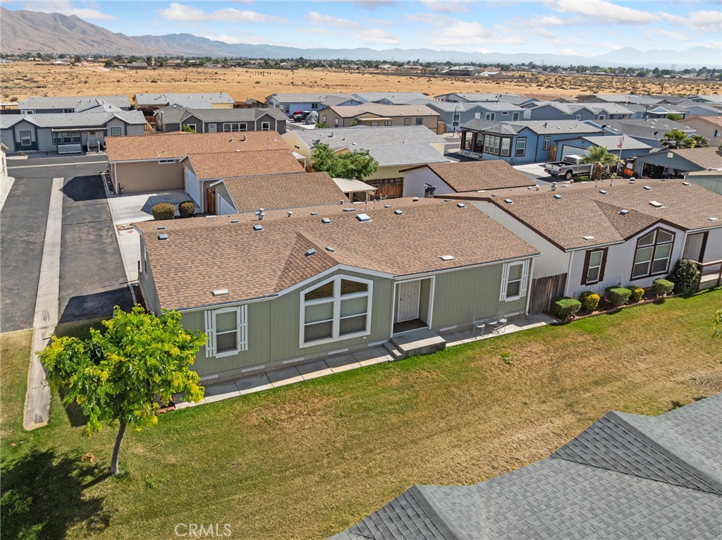 21621 Sandia Road, Unit 128 Apple Valley, CA 92308 - Photo 10 of 41 an aerial view of a house with a yard and ocean view
