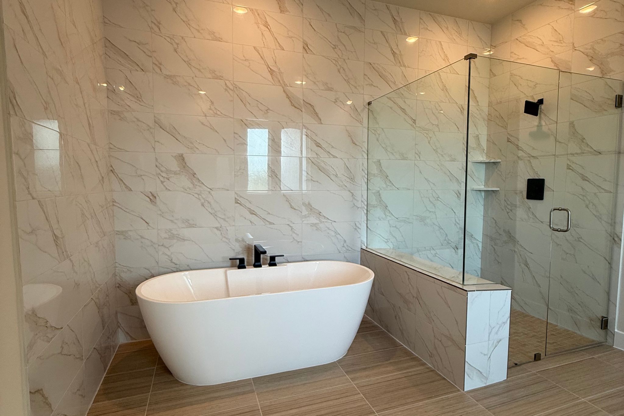 1412 Paxton Lane Georgetown, TX 78633 - Photo 7 of 14 a white bath tub sitting in a bathroom and shower