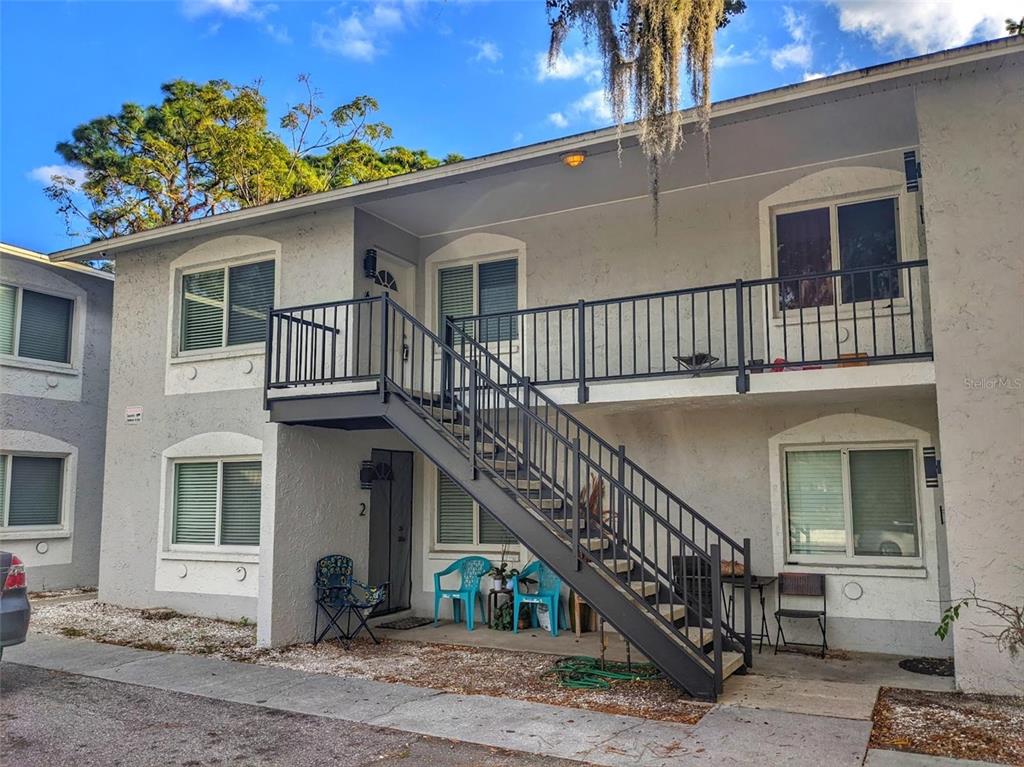 1090 Cocoanut Avenue, Unit 2 Sarasota, FL 34236 - Photo 1 of 8 a balcony with lots of potted plants