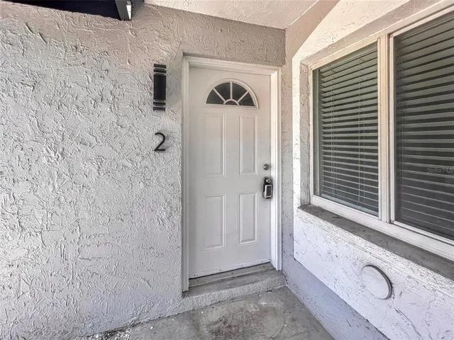 a view of a bathroom with a shower and a sink