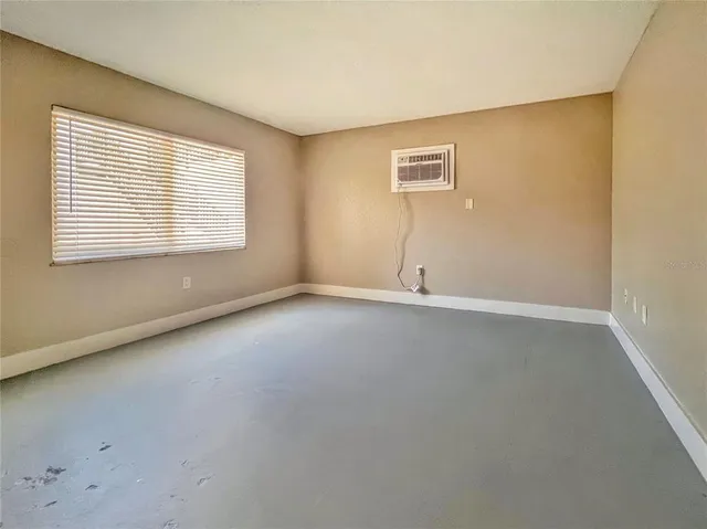 a view of an empty room with a window