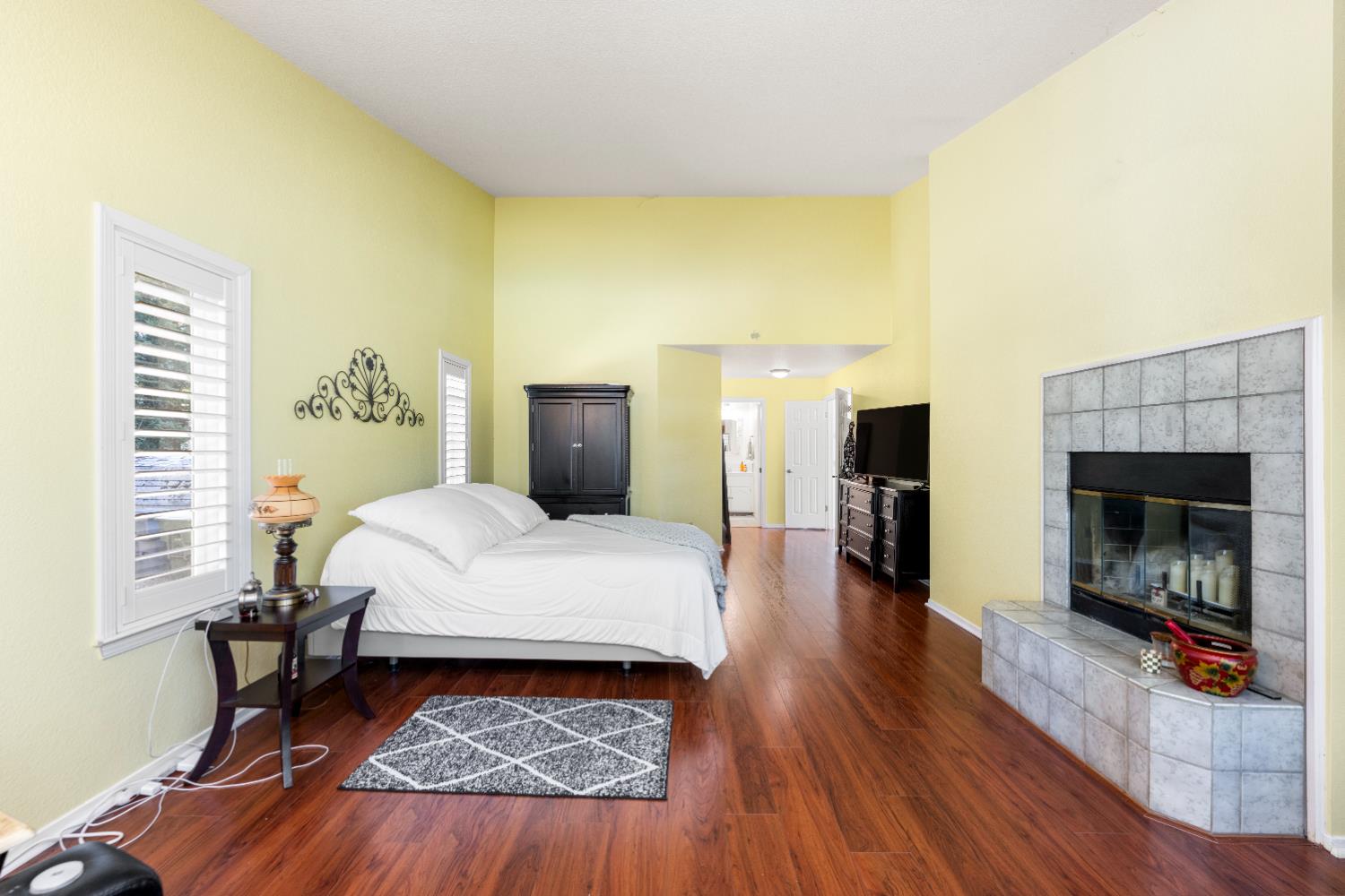 10165 Snowy Owl Way Auburn, CA 95603 - Photo 22 of 48 a bed room with a bed and a fireplace