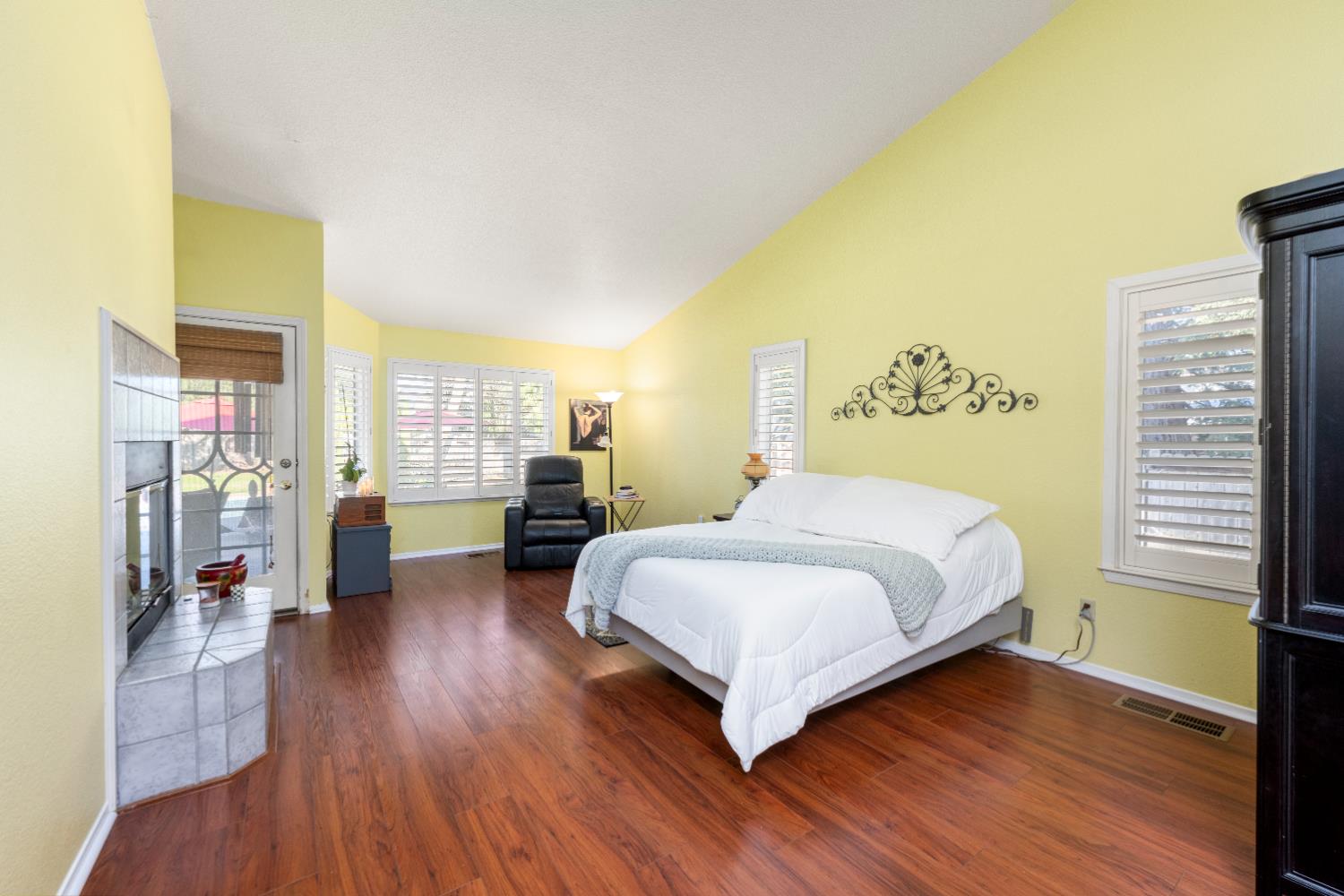 10165 Snowy Owl Way Auburn, CA 95603 - Photo 23 of 48 a bedroom with a bed and wooden floor