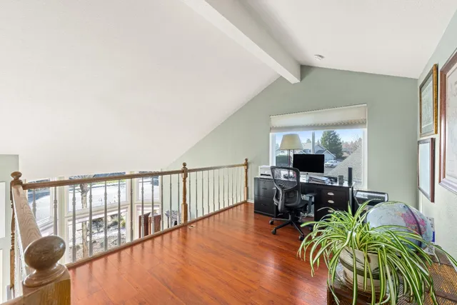 a view of a livingroom with furniture window and wooden floor