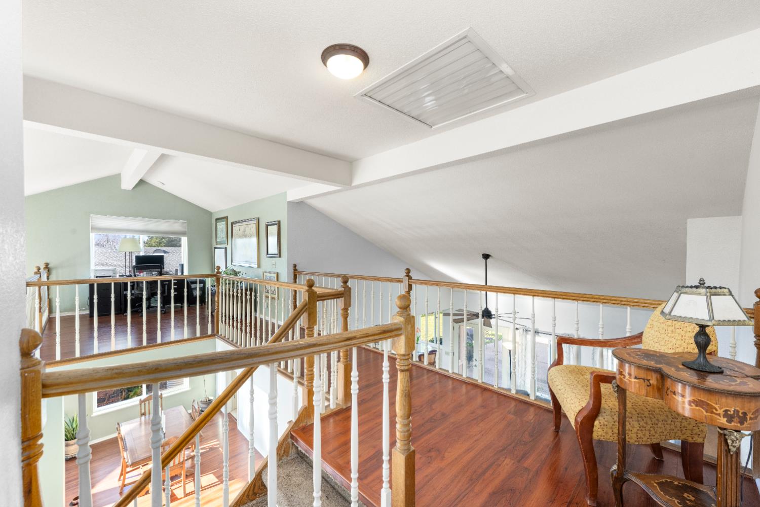 10165 Snowy Owl Way Auburn, CA 95603 - Photo 33 of 48 a view of a hallway with furniture and wooden floor