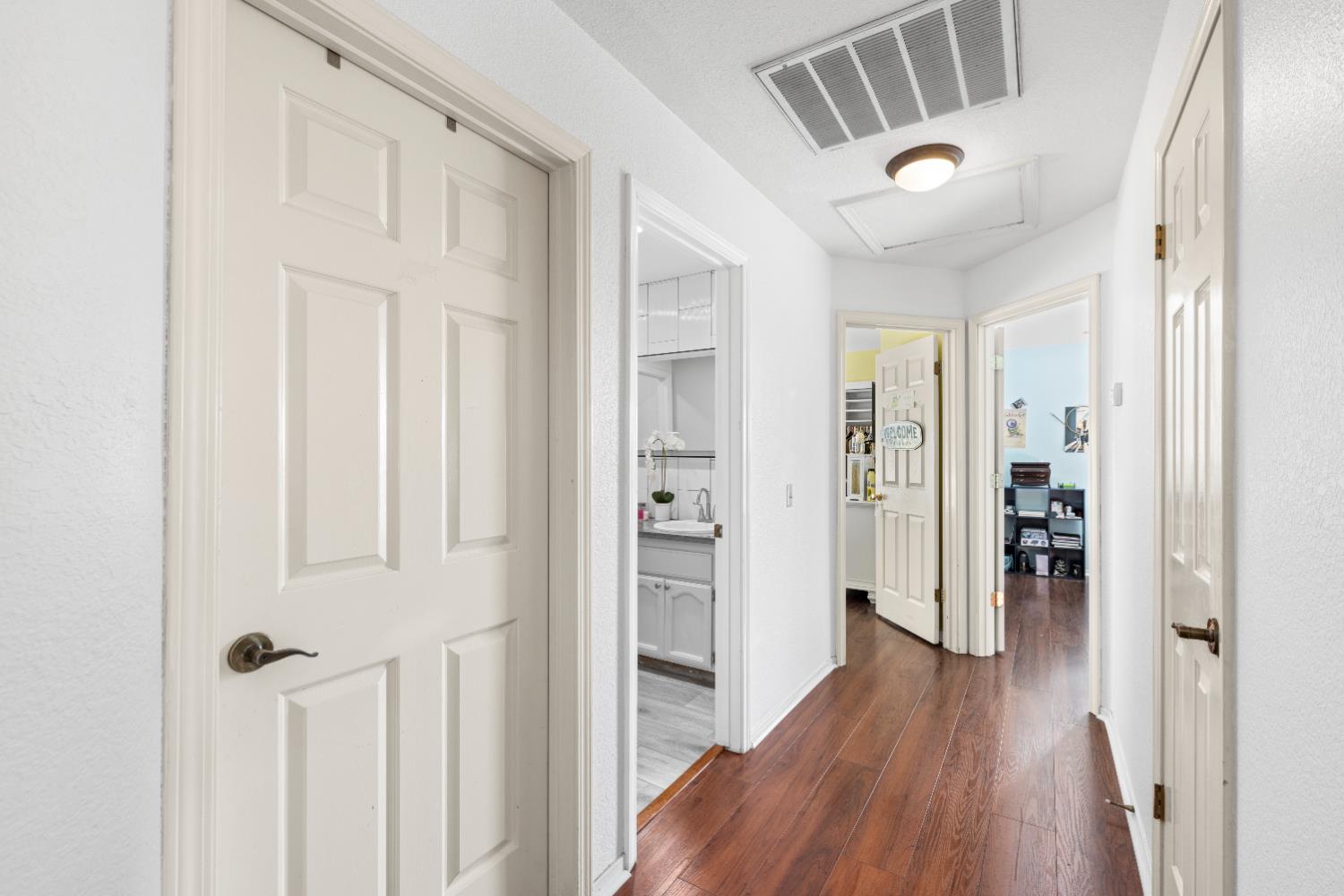 10165 Snowy Owl Way Auburn, CA 95603 - Photo 35 of 48 a view of a hallway with wooden floor