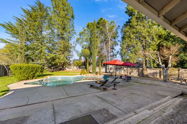 a view of a swimming pool with a patio