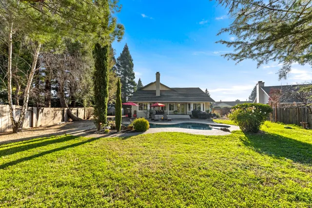 a view of a house with swimming pool