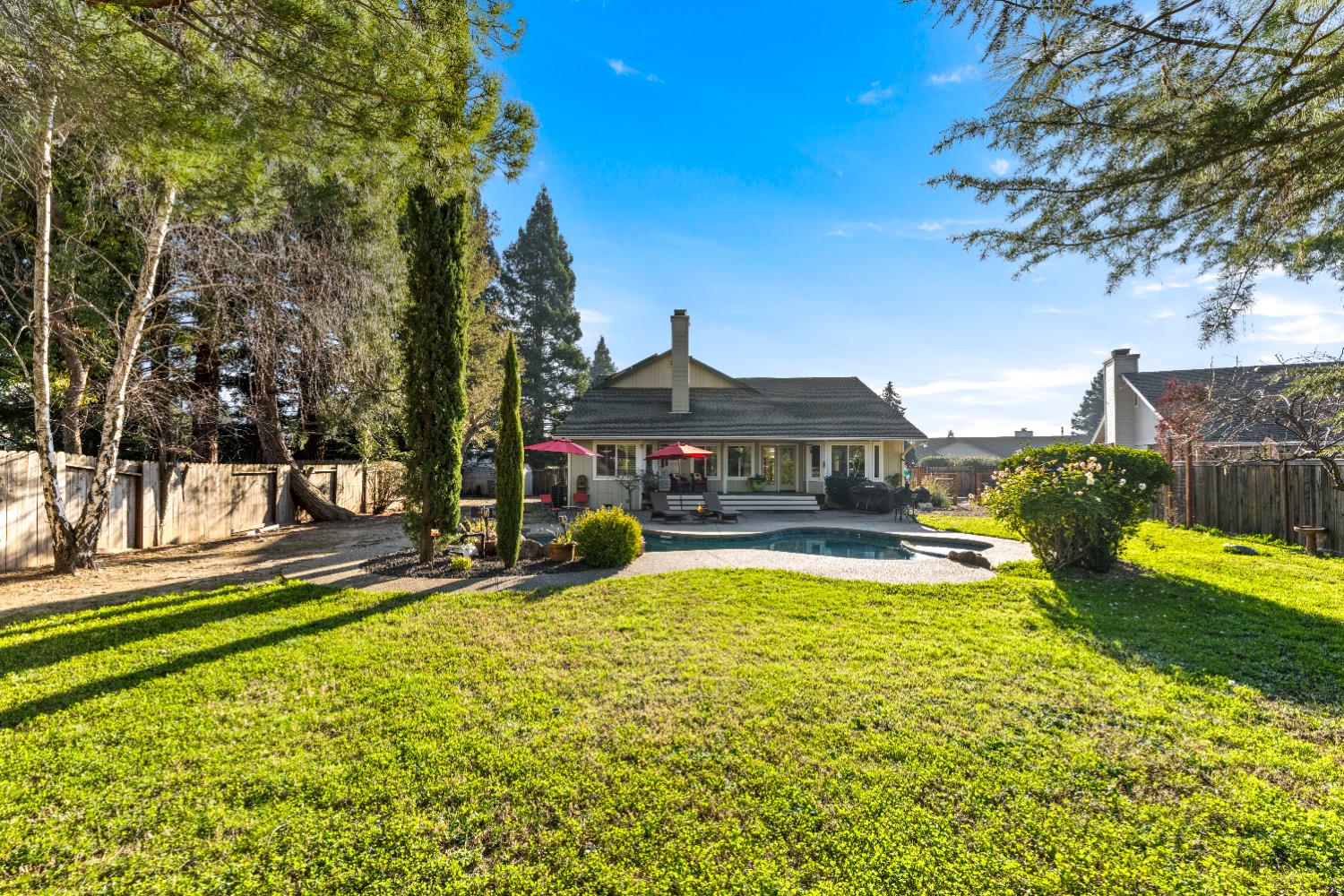 10165 Snowy Owl Way Auburn, CA 95603 - Photo 46 of 48 a view of a house with pool and sitting area