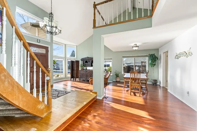 a view of a living room and chandelier in a living room