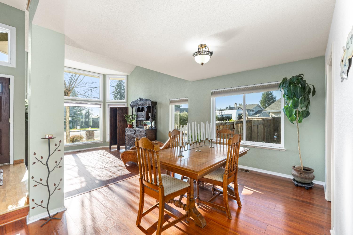10165 Snowy Owl Way Auburn, CA 95603 - Photo 7 of 48 a dining room with furniture window and wooden floor
