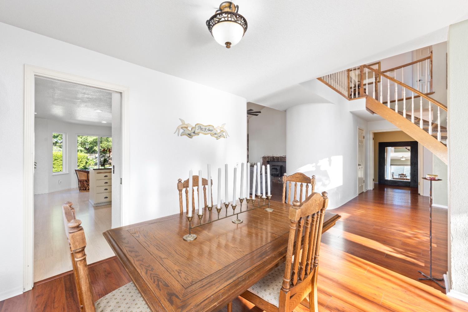 10165 Snowy Owl Way Auburn, CA 95603 - Photo 8 of 48 a dining room with wooden floor table and chairs