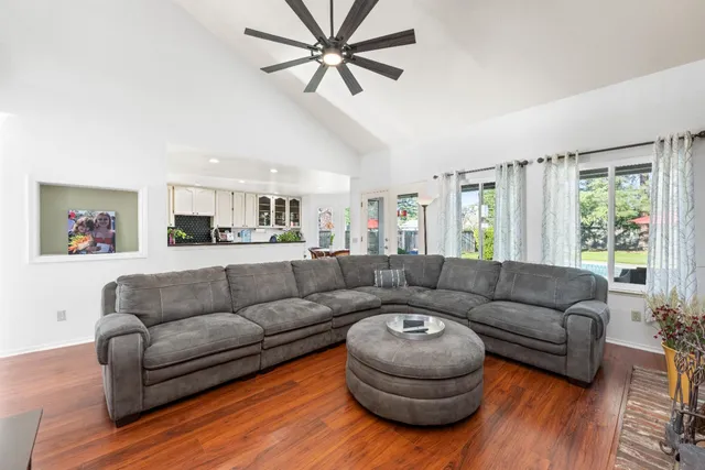a living room with furniture and a large window