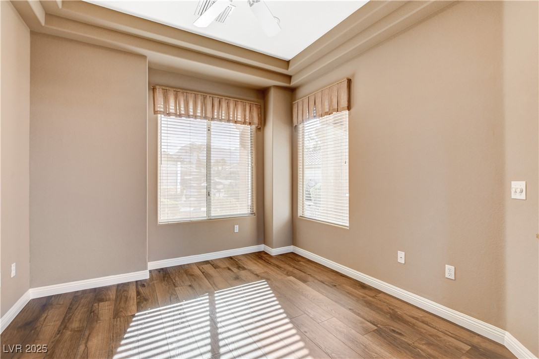 1904 Hot Oak Ridge Street Las Vegas, NV 89134 - Photo 14 of 74 Empty room featuring wood finished floors and ceiling fan