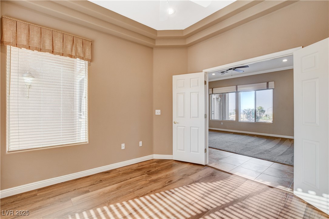 1904 Hot Oak Ridge Street Las Vegas, NV 89134 - Photo 15 of 74 Empty room featuring ceiling fan, wood finished floors, and recessed lighting