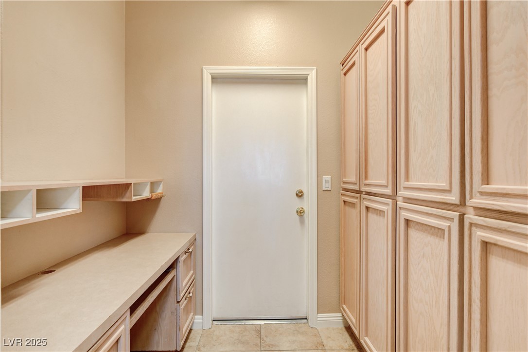1904 Hot Oak Ridge Street Las Vegas, NV 89134 - Photo 27 of 74 Entryway with tile patterned floors and built in desk