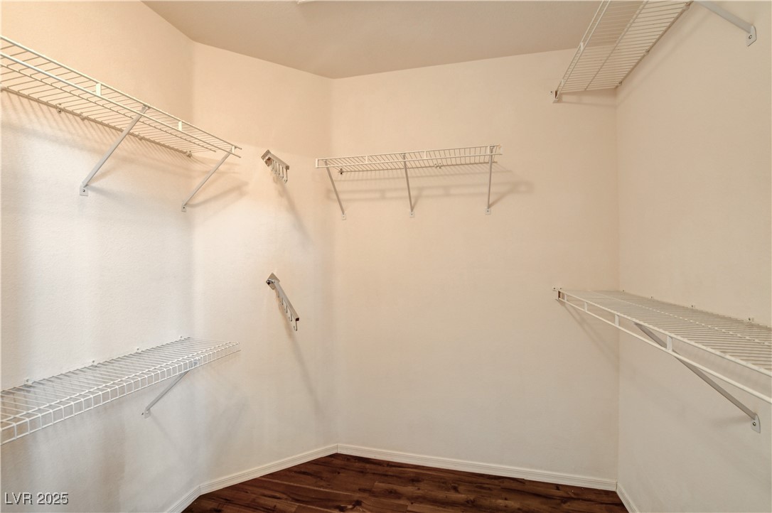 1904 Hot Oak Ridge Street Las Vegas, NV 89134 - Photo 38 of 74 Spacious closet with dark wood-style flooring