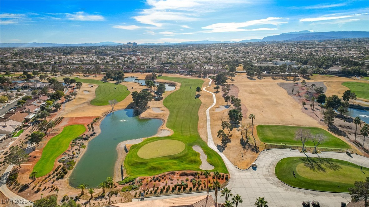1904 Hot Oak Ridge Street Las Vegas, NV 89134 - Photo 67 of 74 Aerial view of residential area with a golf course and a water and mountain view
