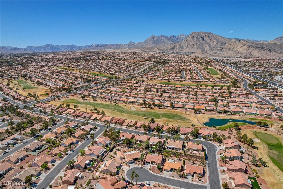 1904 Hot Oak Ridge Street Las Vegas, NV 89134 - Photo 69 of 74 Aerial view of property's location featuring a water and mountain view and nearby suburban area