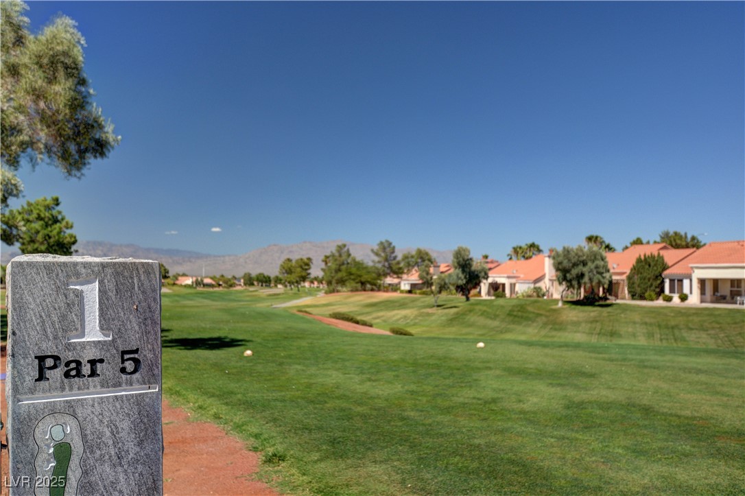 1904 Hot Oak Ridge Street Las Vegas, NV 89134 - Photo 70 of 74 View of property's community featuring a yard, golf course view, a mountain view, and a residential view