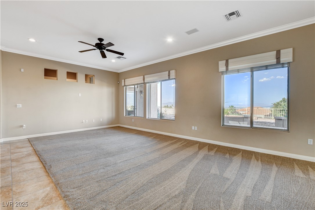 1904 Hot Oak Ridge Street Las Vegas, NV 89134 - Photo 10 of 74 Unfurnished room featuring crown molding, recessed lighting, and ceiling fan