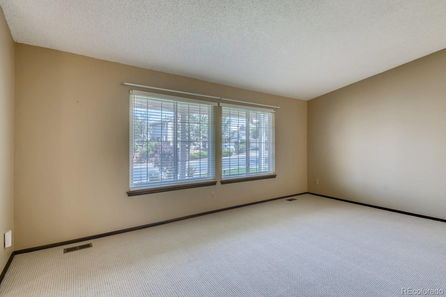 740 Prairie Ridge Road Highlands Ranch, CO 80126 - Photo 5 of 31 a view of an empty room with a window