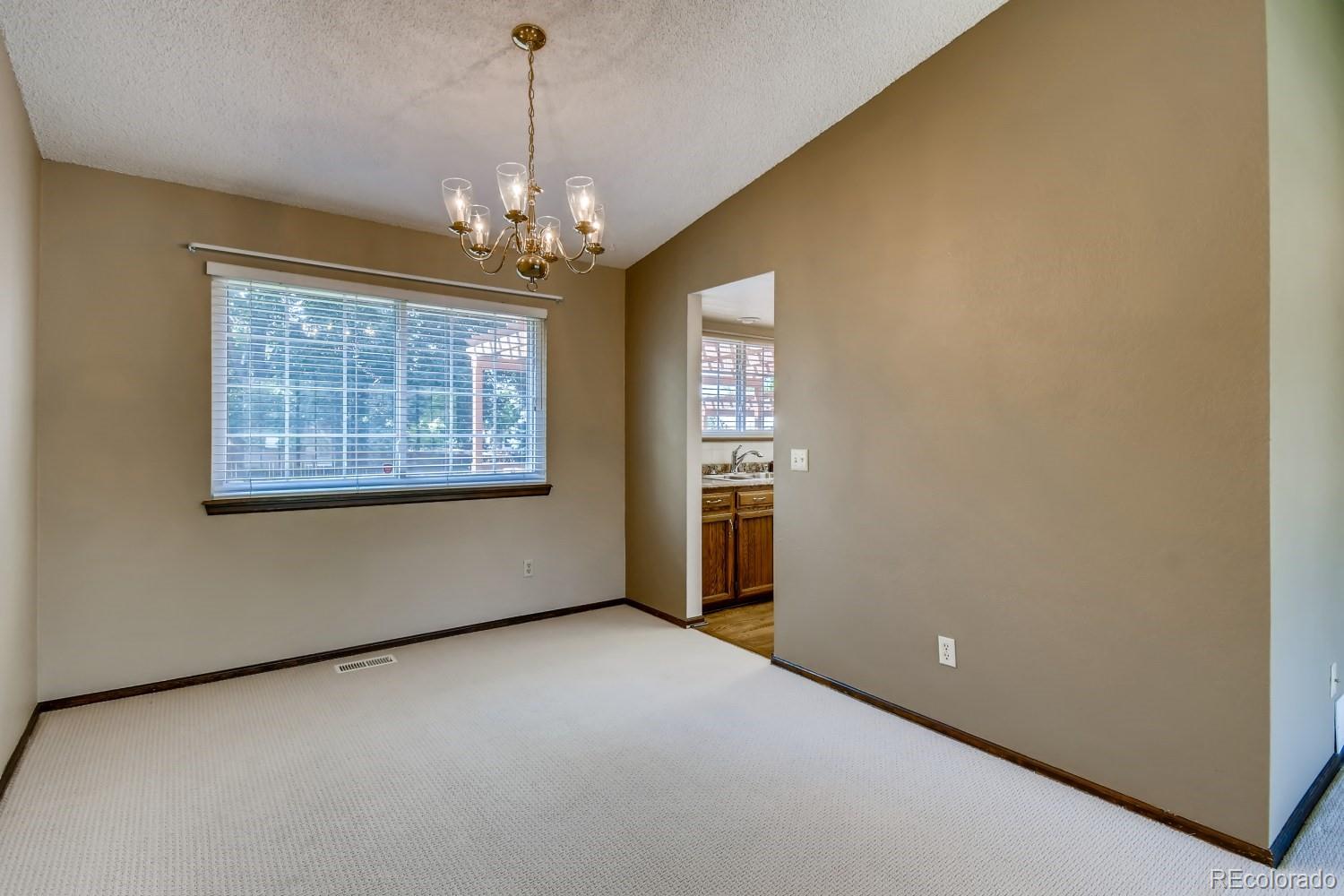 740 Prairie Ridge Road Highlands Ranch, CO 80126 - Photo 8 of 31 a view of an empty room with a window
