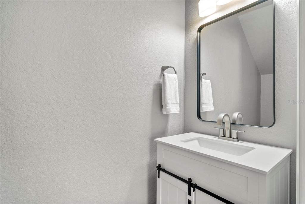 13320 Fernow Street Windermere, FL 34786 - Photo 12 of 52 a bathroom with a sink and a mirror