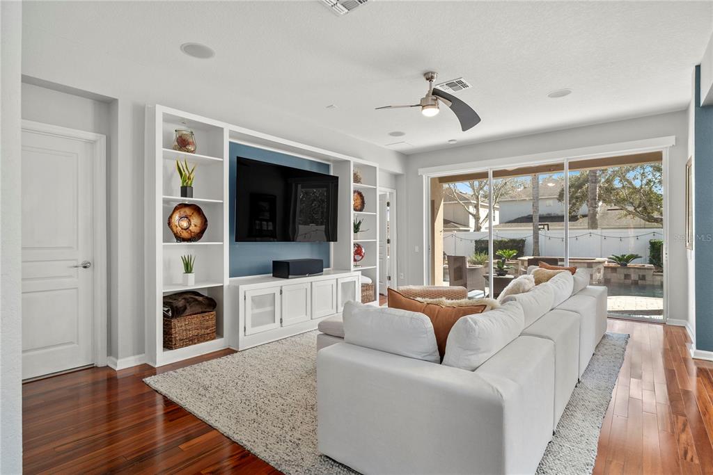 13320 Fernow Street Windermere, FL 34786 - Photo 21 of 52 a living room with furniture a flat screen tv and a fireplace