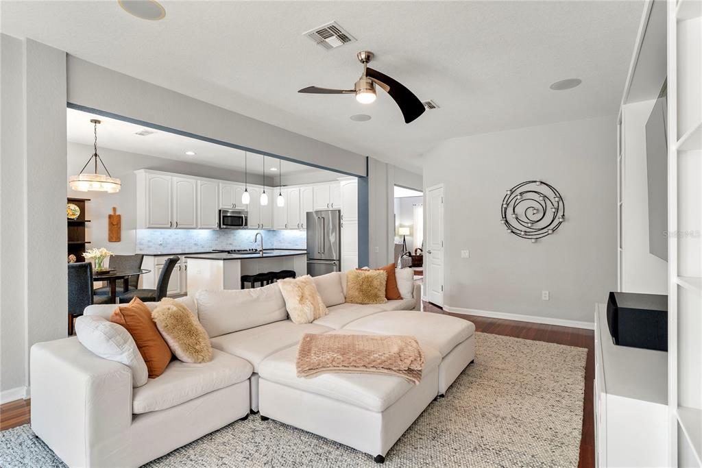 13320 Fernow Street Windermere, FL 34786 - Photo 22 of 52 a living room with furniture a rug and a chandelier